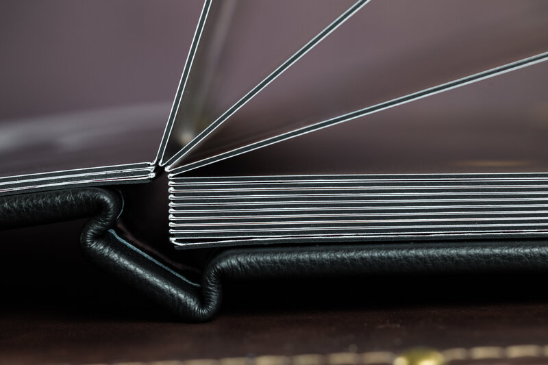 A close-up view of thick heirloom layflat album pages, highlighting premium quality and durability.