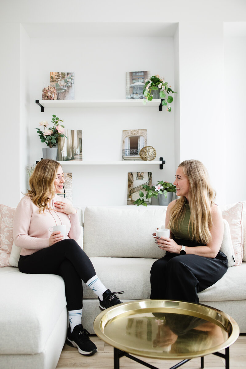Realtor Tamara Rzan laughing with a client while explaining the sale process