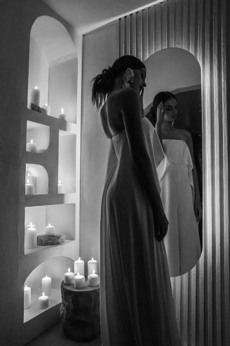 Bride viewing her final beauty look in the mirror