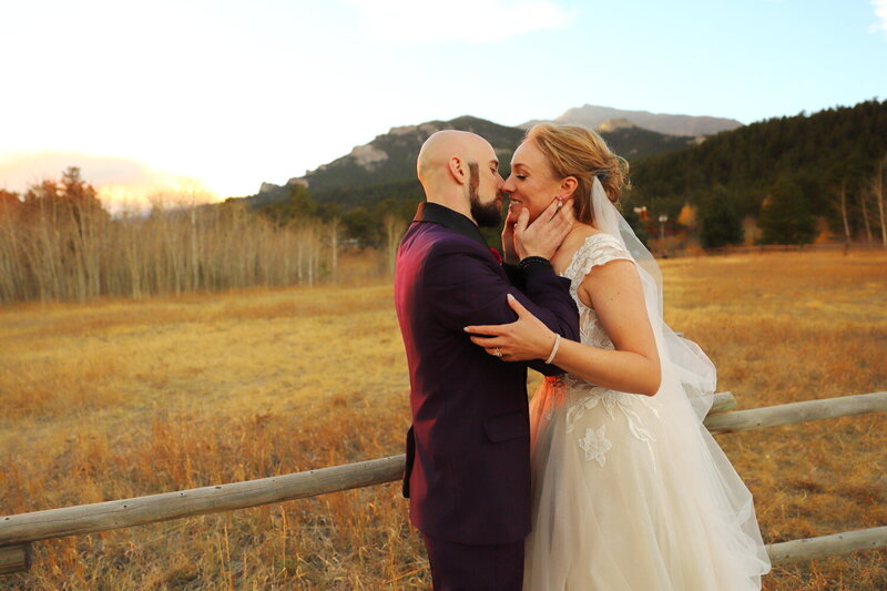 Colorado Bride and groom kissing at sunset on their wedding day in the mountains
