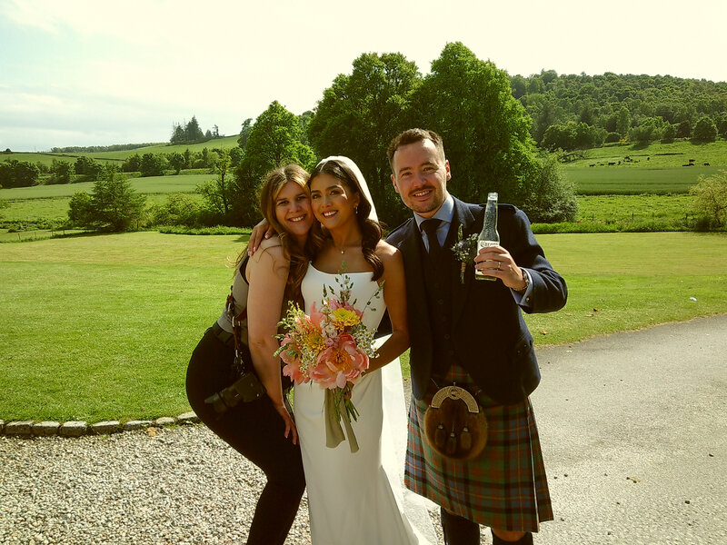 Groom and groomsmen wear sequin waistcoats and pose during alternative scotland wedding photography