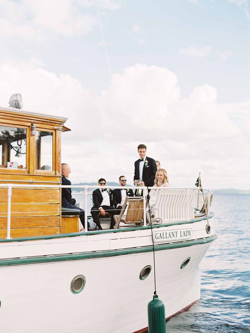bride and groom arrive at wedding on a yacht in lake washington