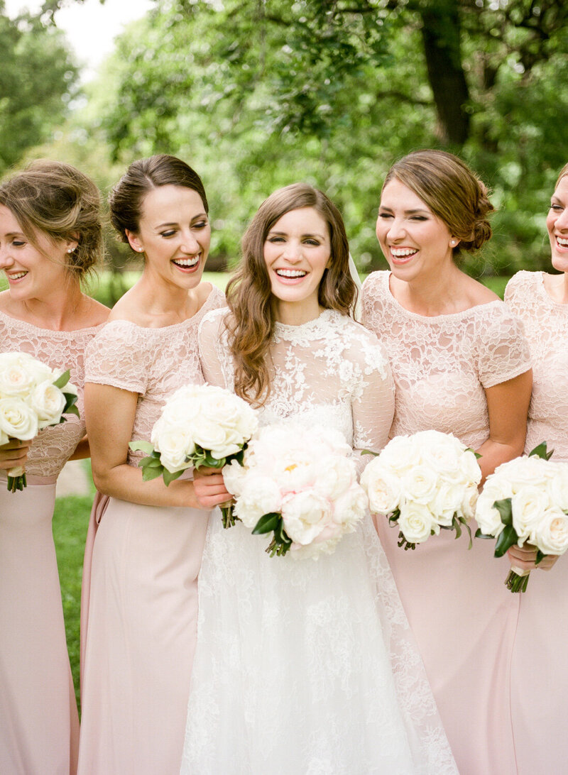 Bride and Bridesmaids Laughing