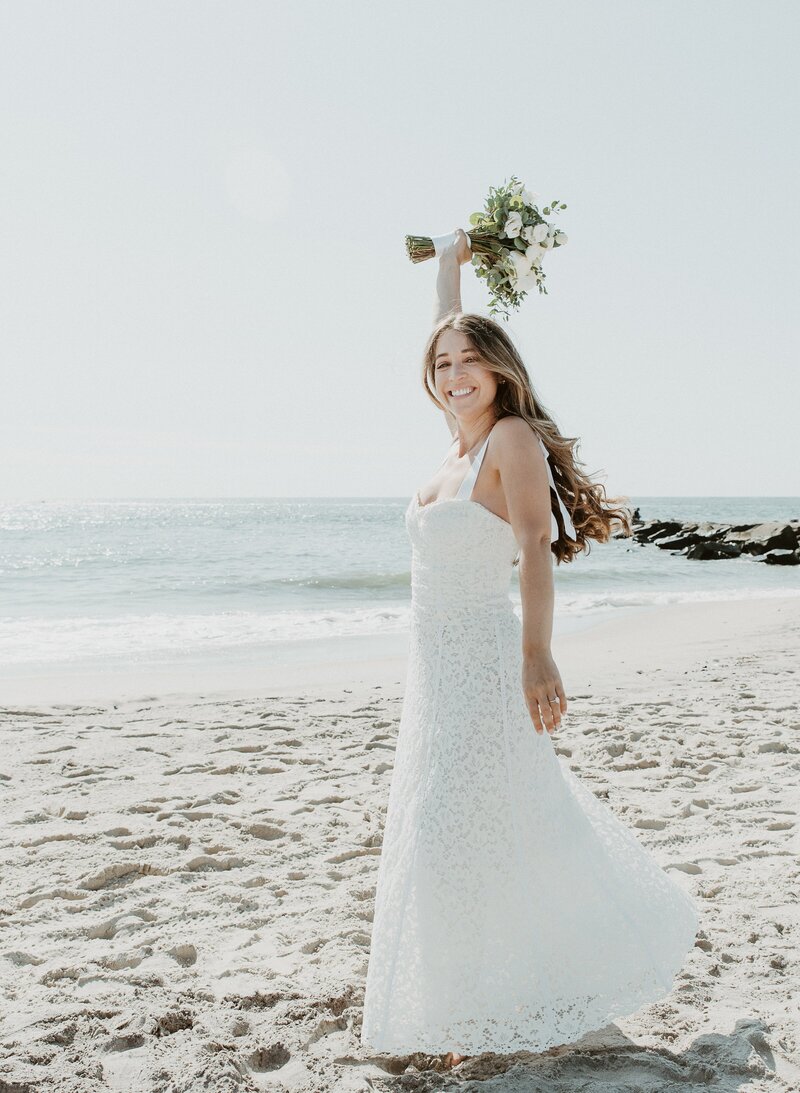 bride dancing on the beach at Laguna Beach elopement