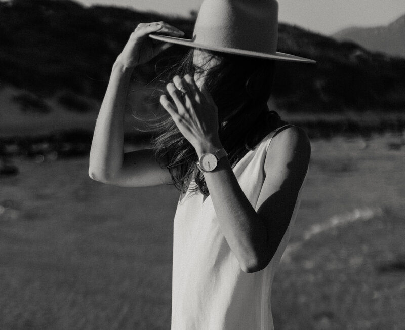 portrait of a young woman wear a hat and a white dress