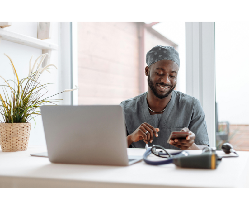 A man in front of a computer