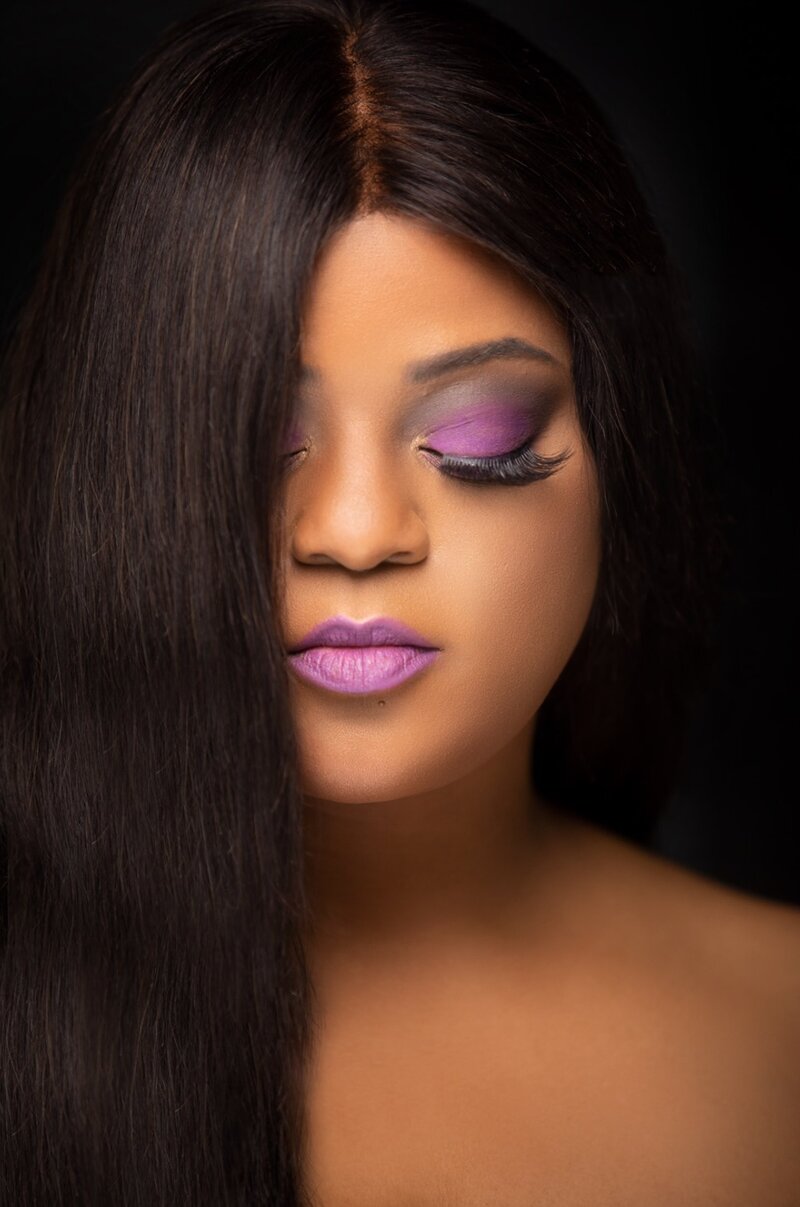 Woman with purple makeup on posing