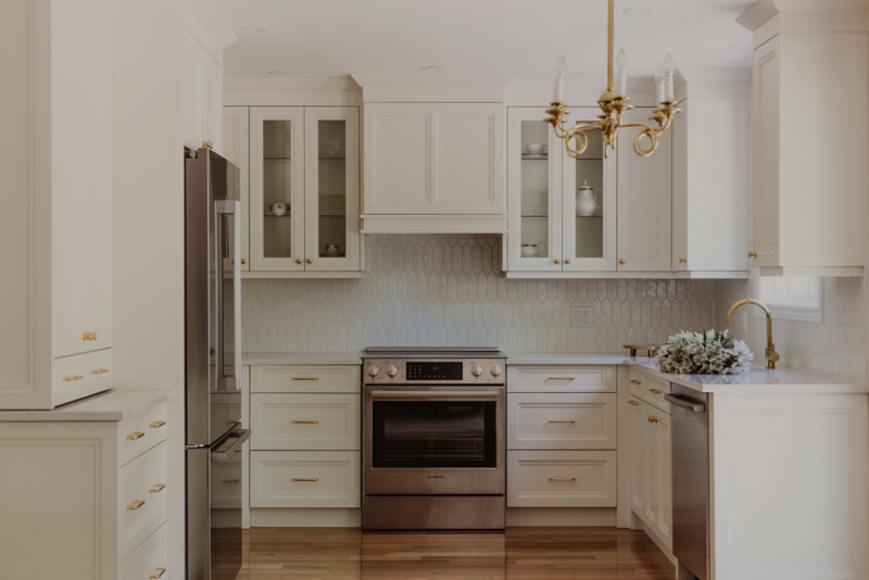 White shaker cabinet kitchen with teak wood dining table
