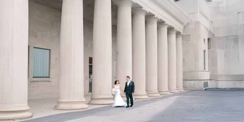 Bride and groom walking near luxury venue