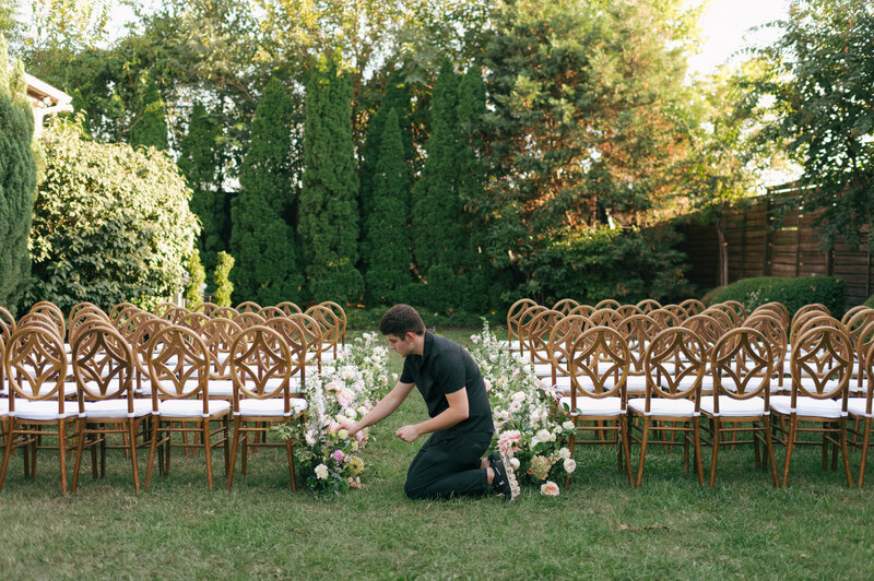 Cole Buys Design wedding florist. Florist setting up a wedding ceremony in Nashville, Tennessee.