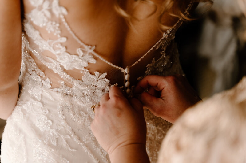bride's dress buttoning