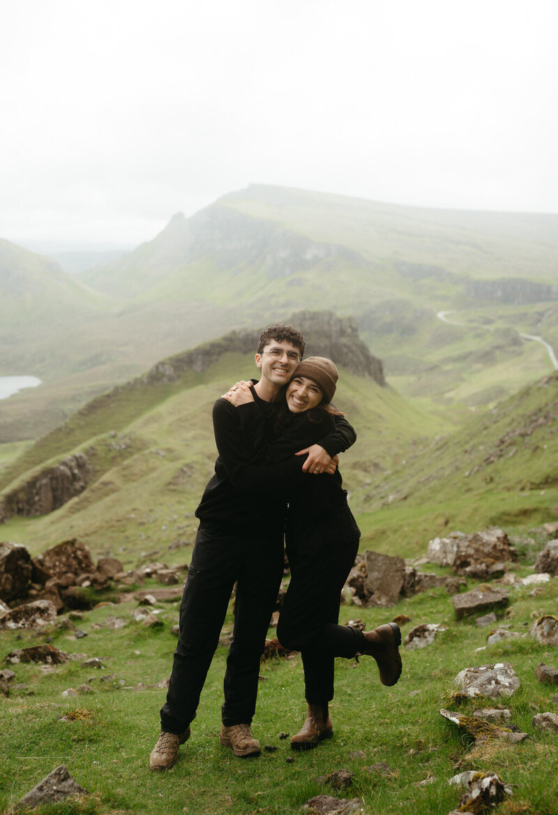 Dolomites Elopement Photographers The Chaffins hugging and smiling with mountains behind them