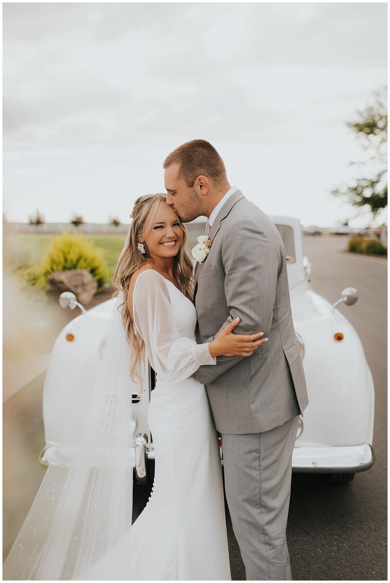 Twin Falls Wedding Photographer - groom kissing bride's forehead at Fleur de Lis in Twin Falls, Idaho