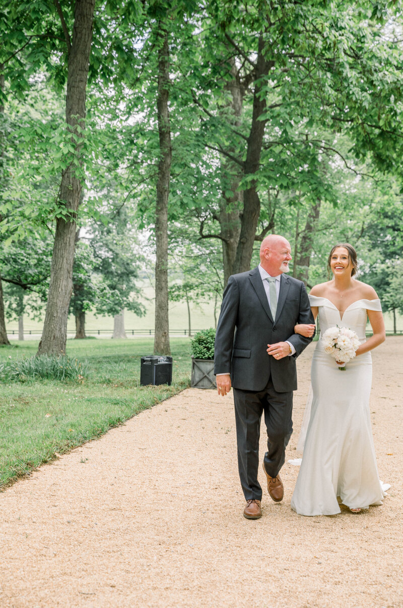 father walking his daughter down the aisle