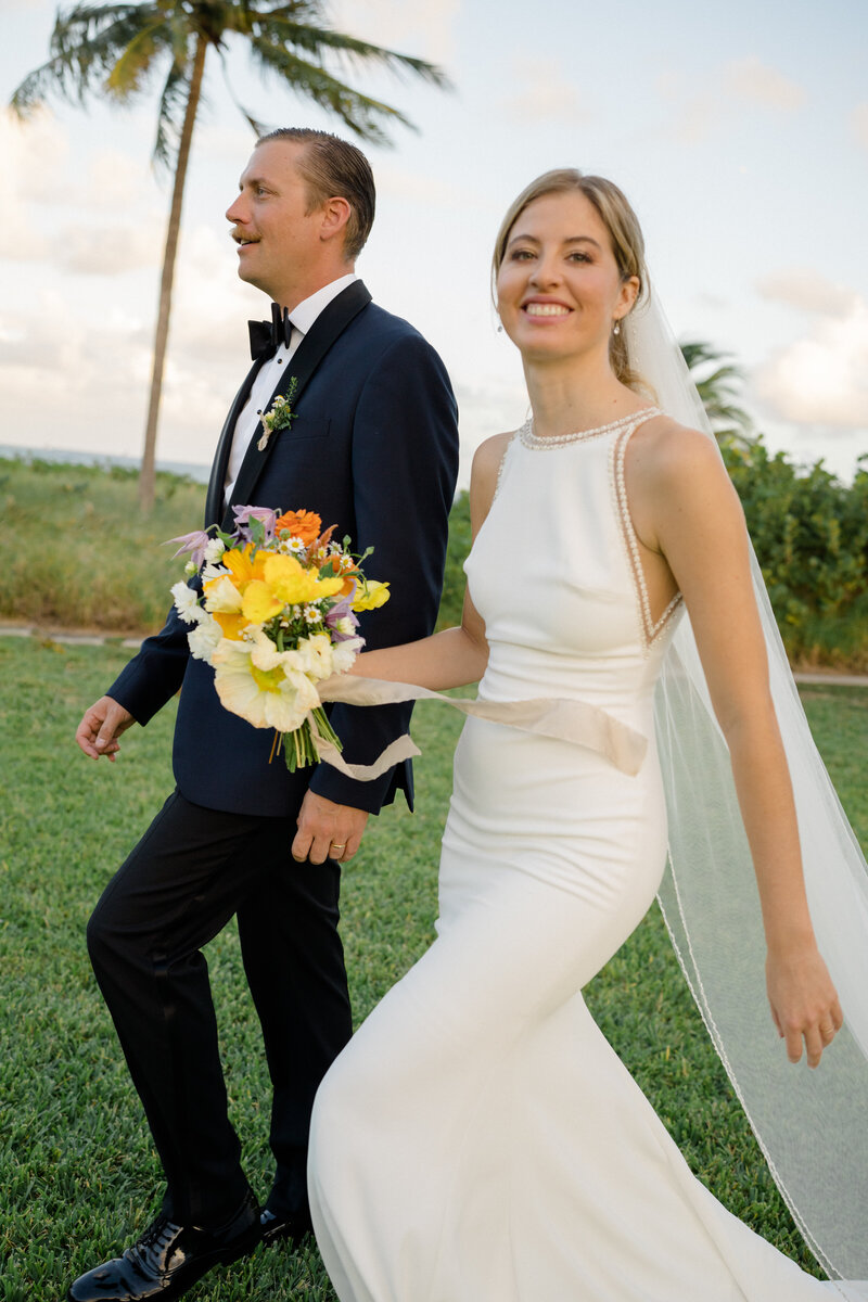 C&D walking away together after the ceremony.
