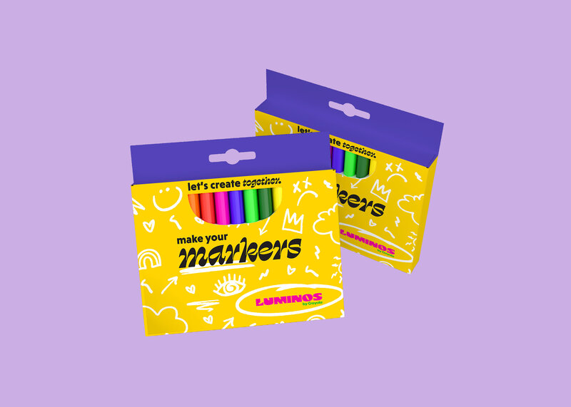 two cardboard boxes of markers