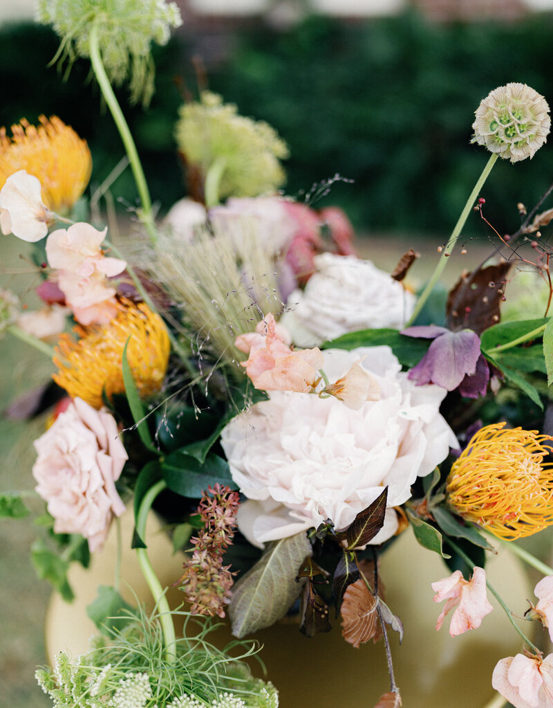 Editorial flat lay of wedding invitation and RSVP, wedding rings, and bouquet of flowers | Megan Smith Photo