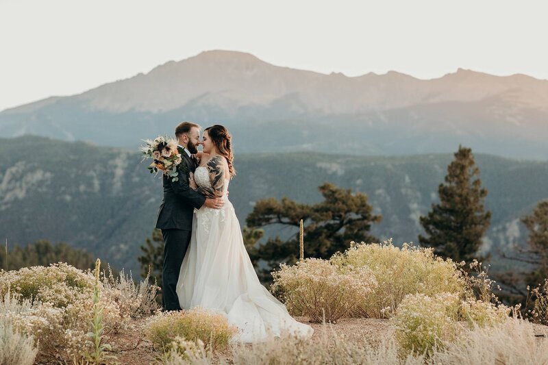 Colorado wedding couple at the base of a mountain