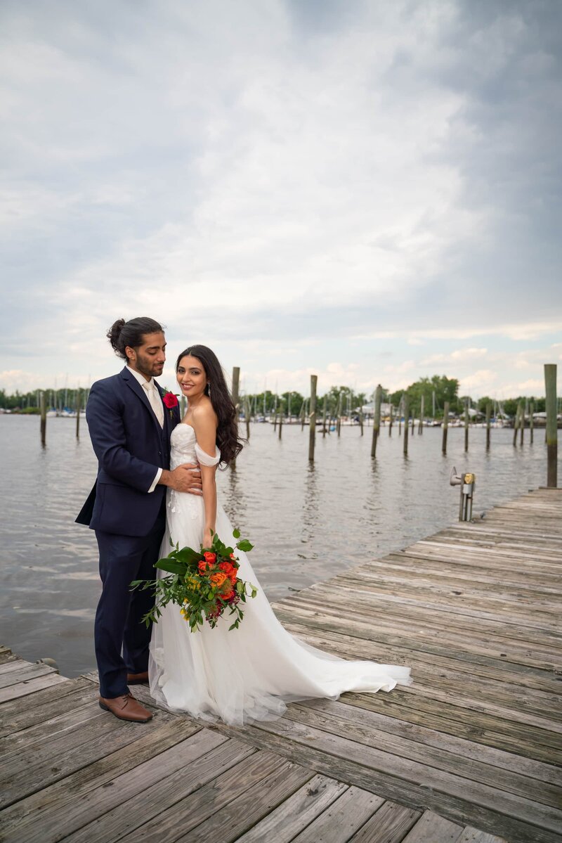 Bride and groom on pier