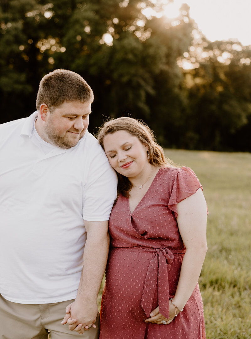 Dothan maternity photo in a field at sunset.