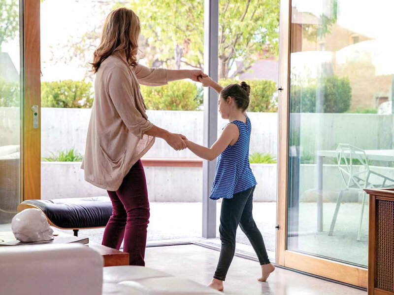 Mother and daughter dancing