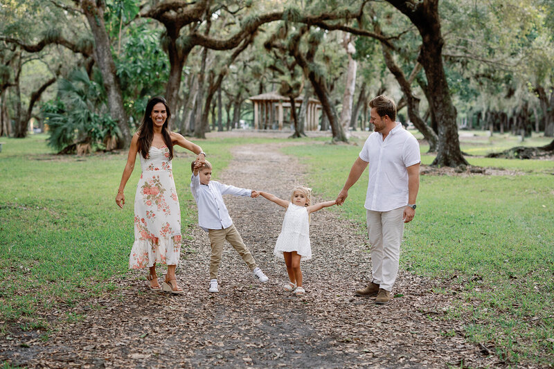 Family walking at sunset at The Ritz Carlton Miami