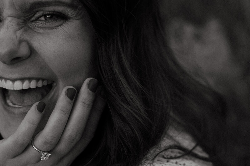 bride laughs with wedding ring on finger