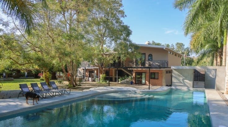 Rancho Poco a Poco is a private jungle estate near Sayulita, ideal for hosting large wellness retreats and events, with upscale facilities and accommodations for up to 18 guests.