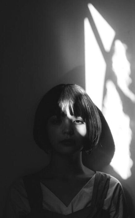 Monochrome photography portrait of girl with fringe.