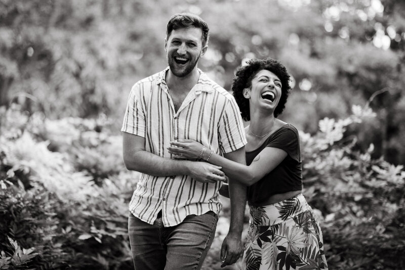 couple laughing together during engagement