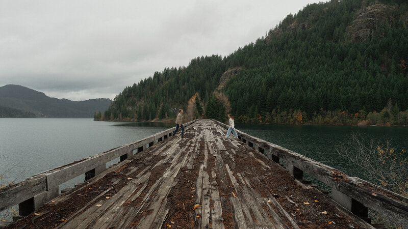Couple on a trestle bridge in Campbell River during their engagement session by latitude 49 photography