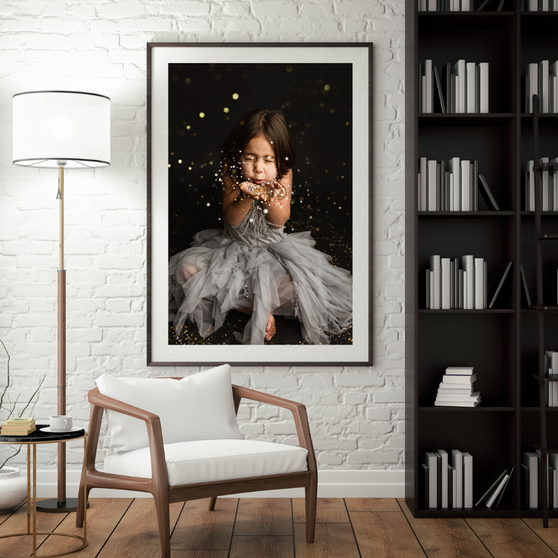 Beautiful Fort Collins girl blowing glitter at her milestone session