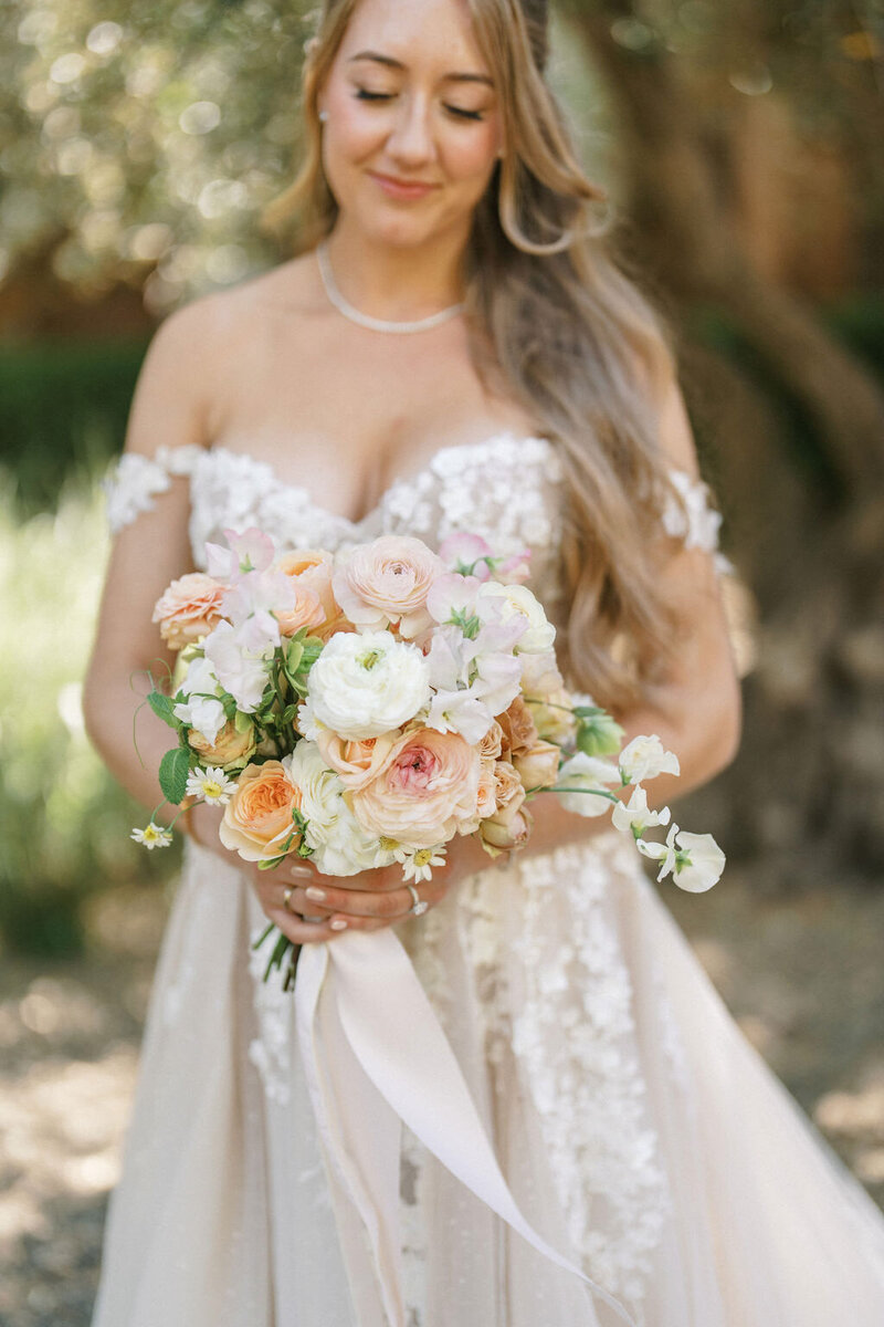 A bride with her bouquet by Bay Area wedding planners Jacinda Weddings & Events.