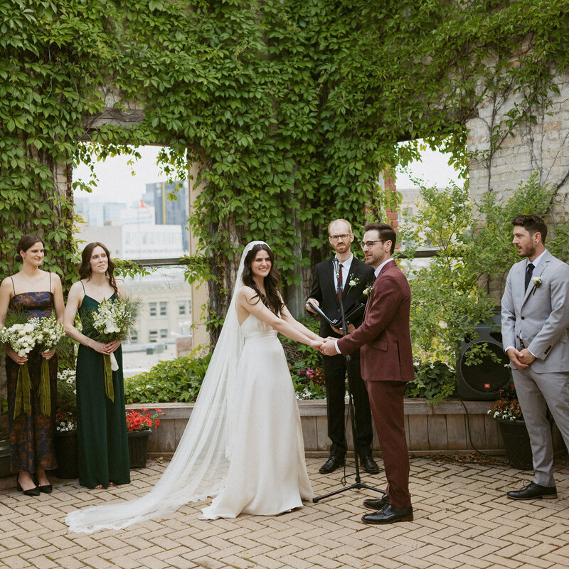 A bride and groom share a joyful moment right after making their vows, celebrating their new journey together.