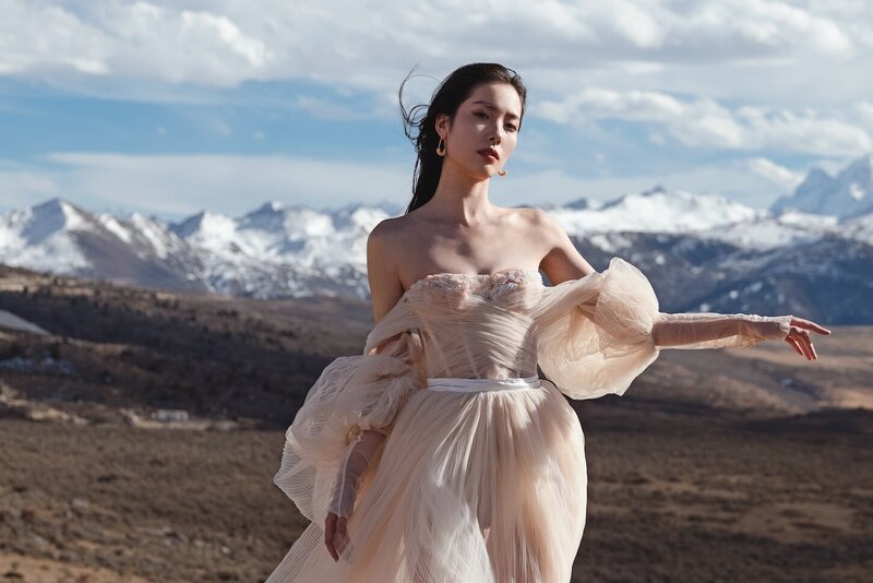 Couture bride shot in dramatic mountain scape.