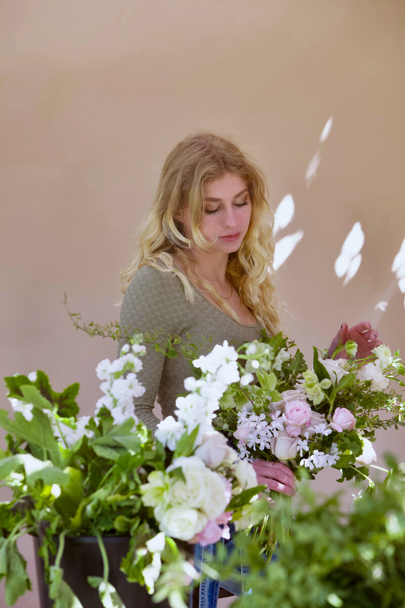 A garden-inspired bridal bouquet held by Ella Kuban
