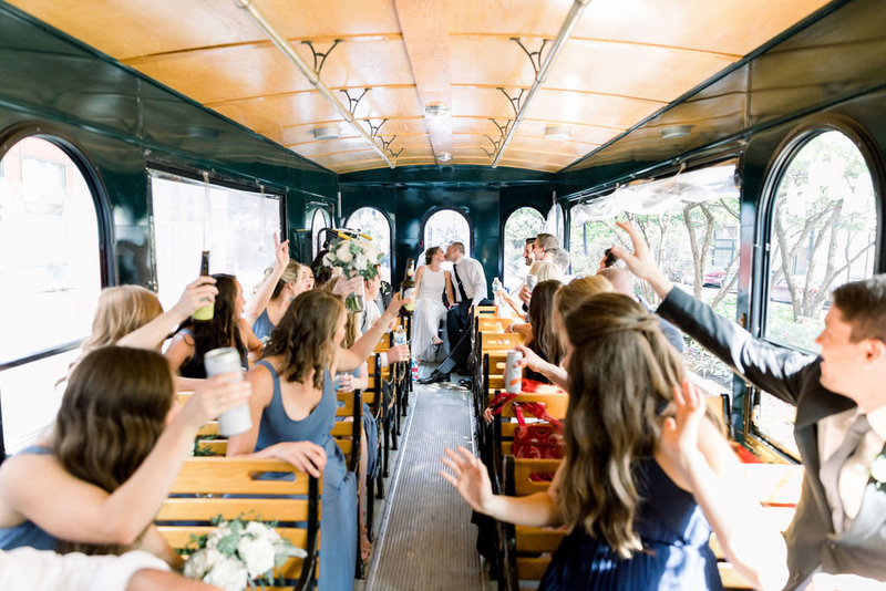 bride and groom kissing in trolley