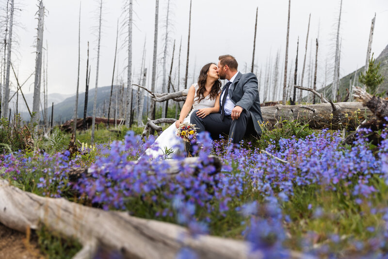 couple kissing in the mountains taken by Montana elopement photographer Marcus Hanenburg Photography