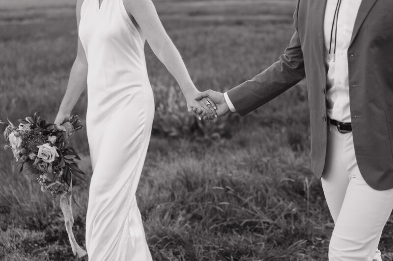 Photo of bride twirling in her wedding dress while smiling taken by Va ail ski resort wedding photographer