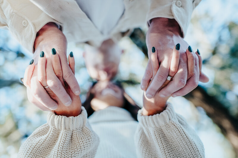 close up of holding hands at old town buffton engagement session