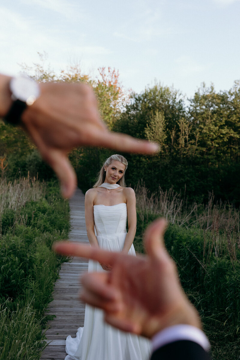 Vermont Wedding Photographers | Sincerely Liz Photography Documentary Wedding, Engagement, Elopement, Maternity and Newborn Photographer in New England | Photo of bride smiling at the camera with the groom's hand out of focus