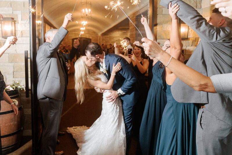 Bride and groom’s grand exit from Canyonwood Ridge reception hall
