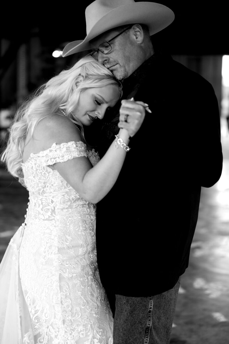 A bride sharing a dance with her father at x venue. 