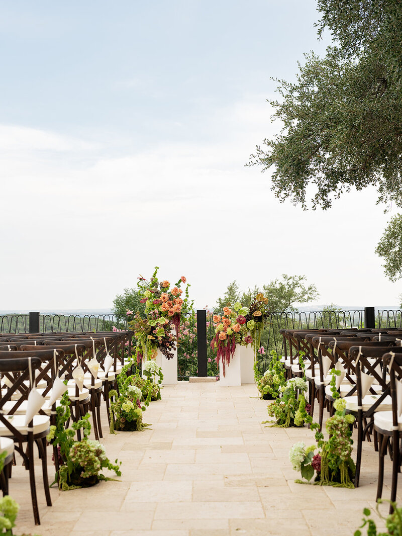 villa-antonia-austin-wedding-ceremony-aisle-floral-pedestals.jpg