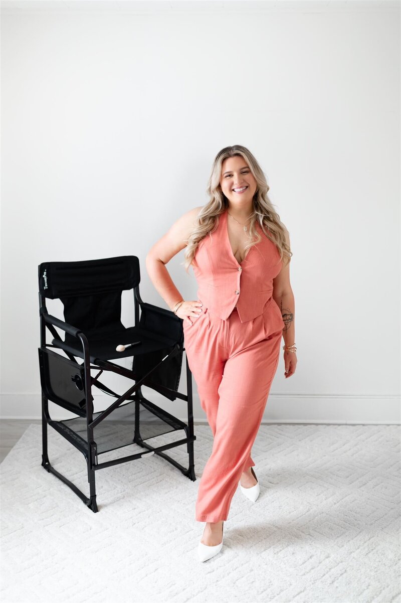Chelsea, a Boston makeup artist, smiles confidently while posing for photos.