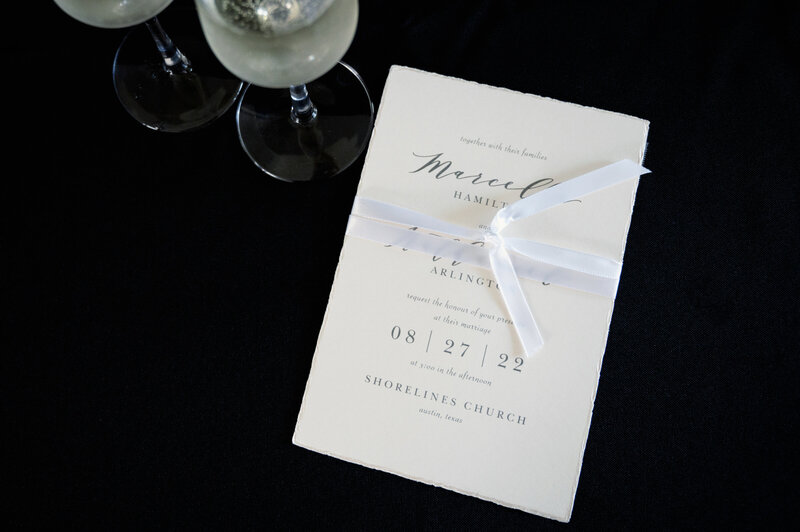 wedding invitation with champagne flutes