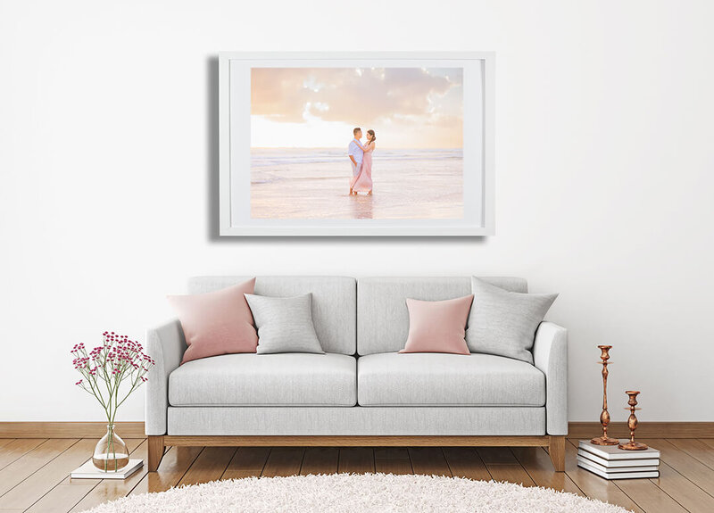 wall art in living room of couple on the beach from their Brisbane engagement photoshoot