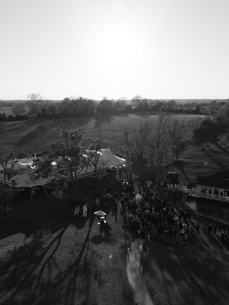 a black and white image of a bride and her father embracing one another