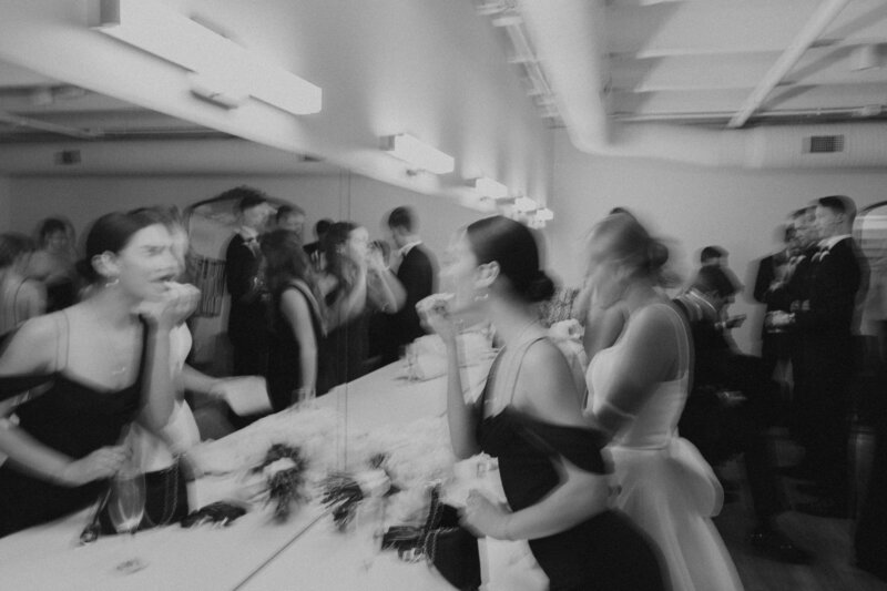 black and white getting ready blurry film vibe with bridal party after ceremony and during cocktail hour. Bridal images and the getting ready mirror at the maverick in kc made for great images