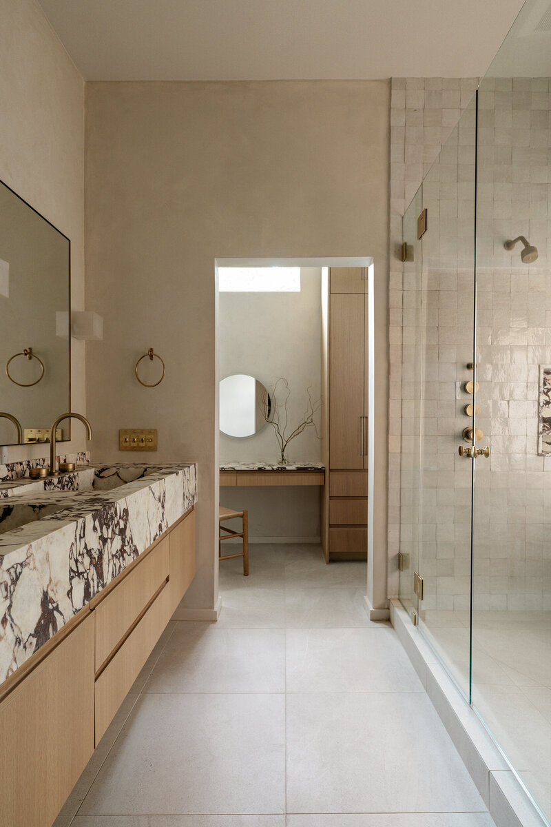 austin-thousand-oaks-oak-vanity-viola-marble-zellige-shower-warm-bathroom-limestone-floors-design-house-franc